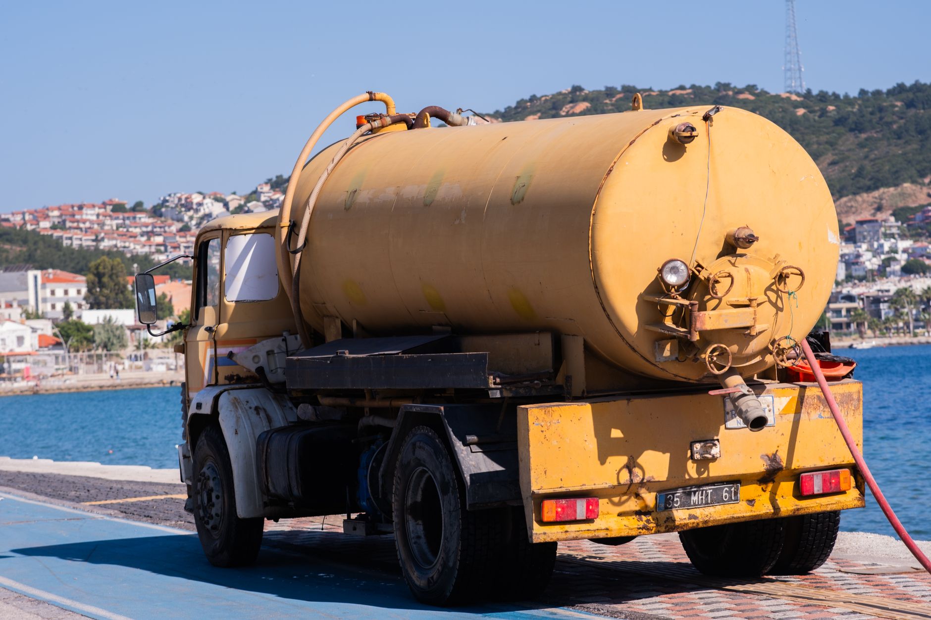 Water service truck near the coast, representing the vehicles and equipment behind reliable pool service in Port St Lucie.